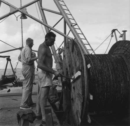 John D. Isaacs and others unload cable