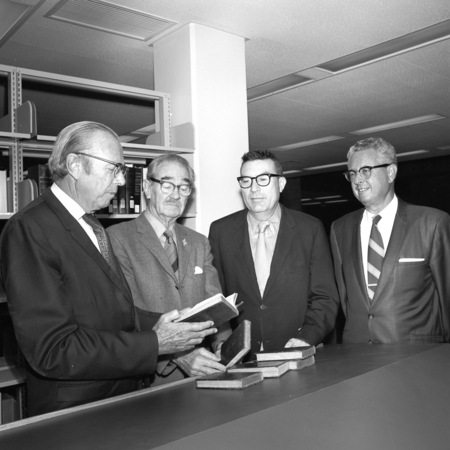 Melvin Voigt, Francis Smith, Herbert York, and an unidentified man during the ceremony commemorating the 3/4 million books...
