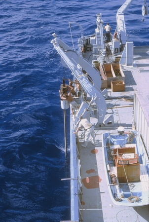 Deploying corer on R/V Melville. Antipode Expedition. Indian Ocean, June 1971-August 1973. n.d.