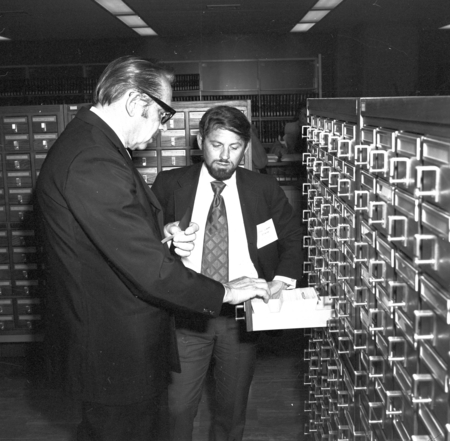 Melvin Voigt and Philip Smith at card catalog, Library dedication, UC San Diego