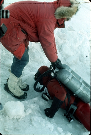 WQB dragging diver out of ice hole. Antarctica.