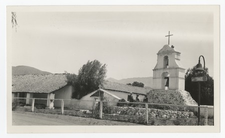 People in front of the bell tower at Pala Mission
