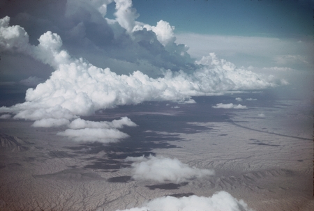 Cu clouds over Sonora Desert E. of Tiburon Is., Gulf of Calif. VII-27-52 c. 1530