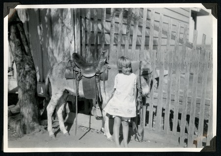 Mildred Christman and her pet burro at the Johnson Ranch at San Antonio del Mar