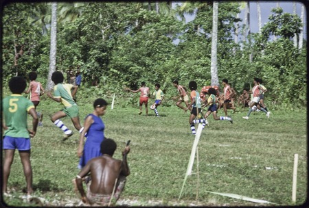 Soccer (football) match, men running on field