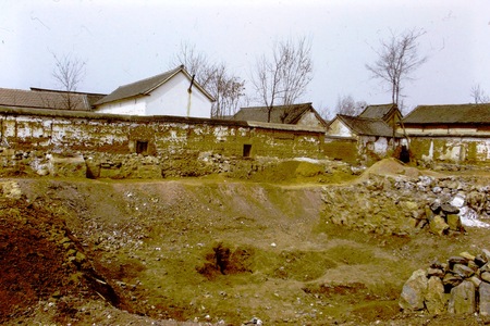 Village wall and construction site