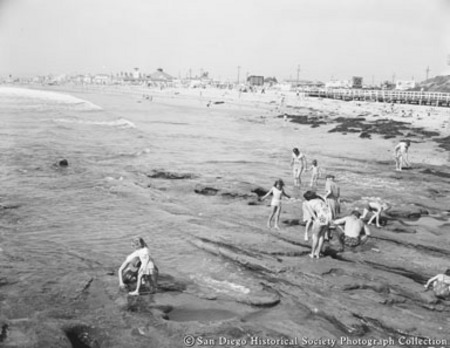 People exploring tide pools on Ocean Beach