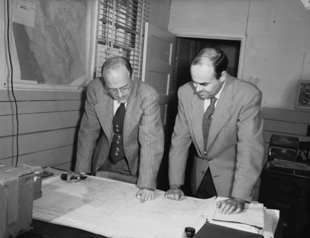 Warren Wooster and John D. Cochrane at desk