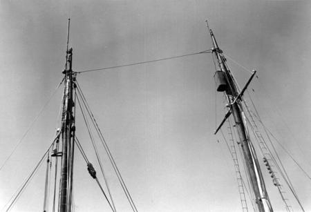 A view of the two antennas is shown in Fig. 10. The 30.3 megacycle antenna on the foremast, at left, and the 117.9 megacyc...