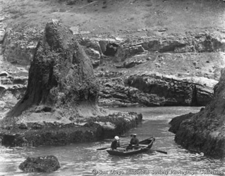 Two men in rowboat near Chocolate Rock, Coronado Islands