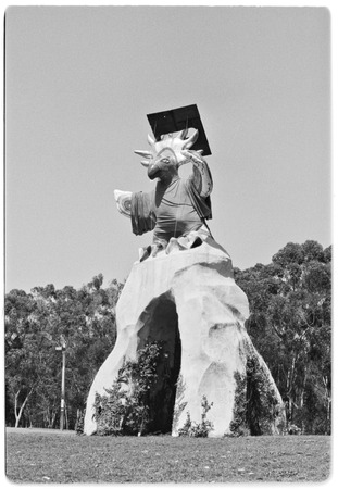 Sun God dressed in a cap and gown for commencement