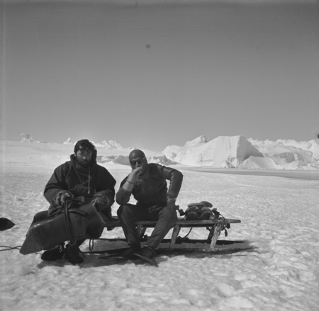 Alexander F. Pushkin (left) and Eugene N. Gruzov (right), resting on the sledge between dives