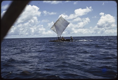 Manus: sailing canoe in open ocean near Pere village, sail up