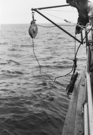 Lowering bathythermograph Mech-I-Tron HY Tech onboard R/V CREST, February 1959