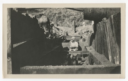 Laborer in trench repairing the San Diego flume following the 1916 flood