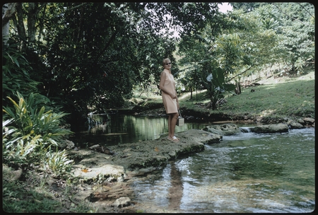 Anne Scheffler standing beside a creek