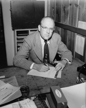 Warren Wooster at desk