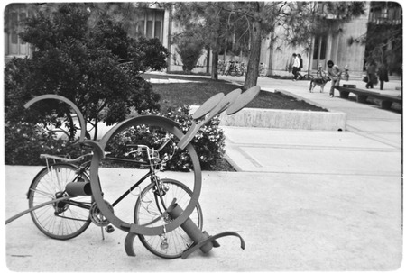 Bicycle chained to sculpture