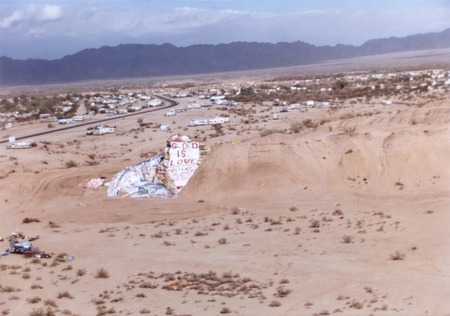 Slab City: photograph of Salvation Mountain with Slab City in the distance
