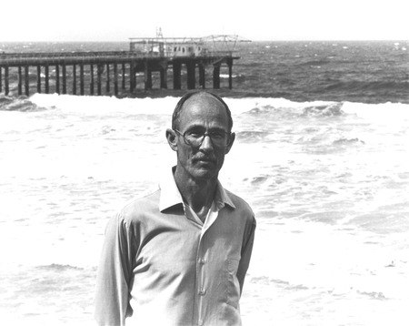 Robert Hessler, standing with Scripps Institution of Oceanography pier in background. n.d.