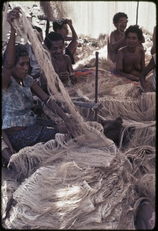 Mortuary ceremony: women weave long banana fiber skirts for exchange
