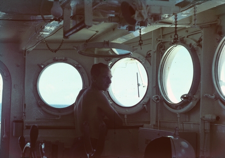 Captain James Lawrence Faughn shown here on the bridge of the R/V Horizon during the MidPac expedition. 1950.