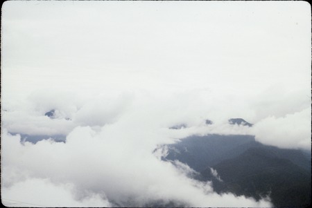 Clouds over Papua New Guinea mountains, aerial view