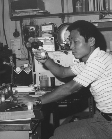 Masuru Kono, a paleomagnetist from the Geophysical Institute, University of Tokyo, examines a core sample prior to magneti...