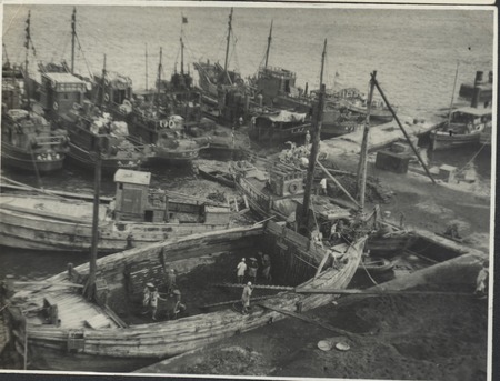 Boat construction in a harbor, during Claude M. Adams visit to a Japanese fishing village and fish processing plant. Japan...