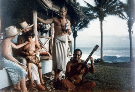 Walter Munk, with his wife Judith Horton Munk and daughters Kendall and Edie, in the fale the family lived in while on Ame...