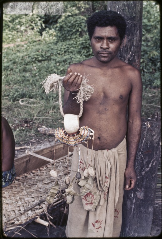 Kula ring: man displays white shell armband (mwali) | Library Digital  Collections | UC San Diego Library