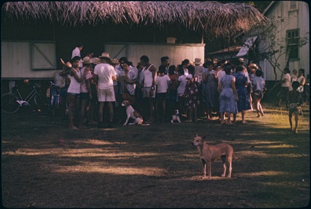 Local people wait to view archaeology exhibit, Moorea