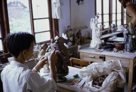 Ceramics factory artisan making sculpture