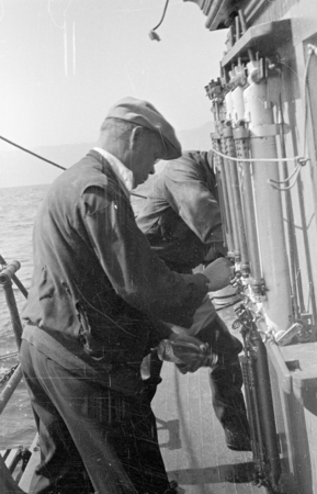 Erik Gustaf Moberg taking seawater from Nansen bottles aboard R/V Scripps
