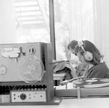 Student listening to tape recorder, Galbraith Hall, UC San Diego