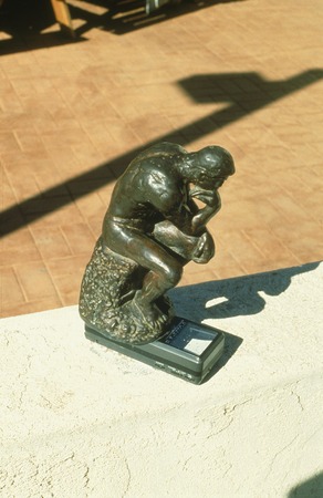 Something Pacific: detail: bronze figurine of Rodin&#39;s &quot;The Thinker&quot; on top of miniature portable television