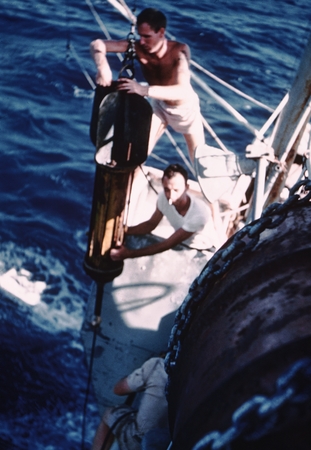 Arthur Eugene Maxwell and Jeffery Dean Frautschy working on deep bathythermograph onboard R/V Horizon