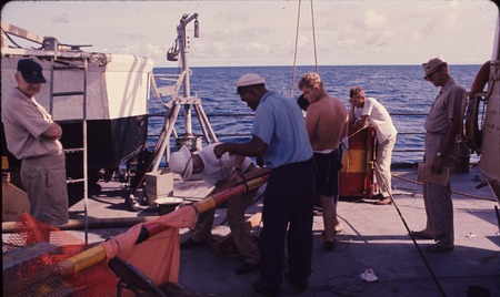 Working with an instrument buoy, onboard the USC&amp;GS Pioneer during the International Indian Ocean Expedition. 1964