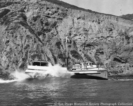Tuna boat North American grounded below cliffs on San Diego coast