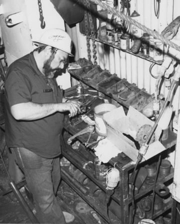 Paul Laughlin, electronics technician, working on equipment that was used during Leg 65 of the Deep Sea Drilling Project. ...