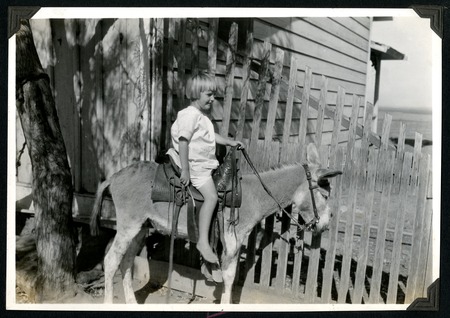 Mildred Christman and her pet burro at the Johnson Ranch at San Antonio del Mar
