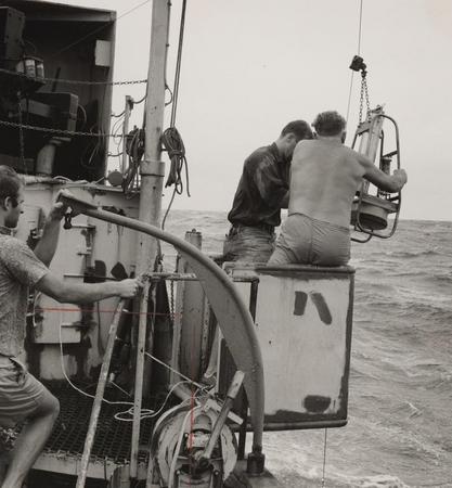 Baron E. Thomas (left) and George W. Hohnhaus (right) with pinger on R/V Horizon during Nova Expedition, July 1967