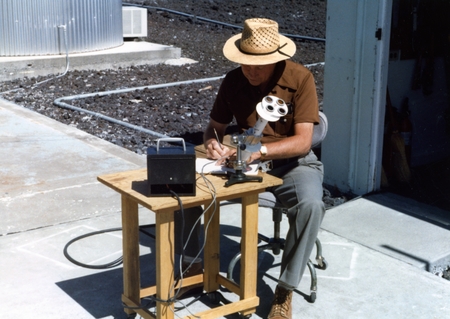 Person at the University of Hawaii Mauna Loa Observatory, using an unidentified device