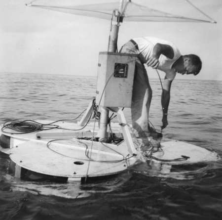 Willard N. Bascom and his floating wave recorder raft and recording instrument package. Capricorn Expedition, October 1952