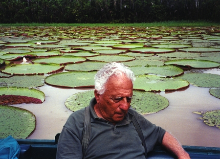 Edward D. Goldberg, possibly napping or perhaps deep in thought, in front of a lily pond. Goldberg was a marine chemist at...