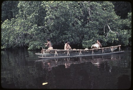 Canoe used for coastal transport, baskets and bundles on platform