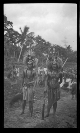 Portrait of two men wearing traditional Samoan clothing and ornaments