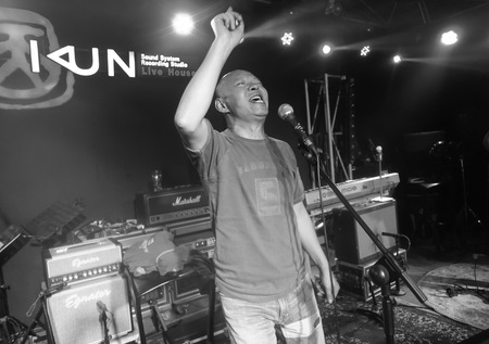 Yue Minjun singing the blues in a music studio in Songzhuang art colony 6 of 11
