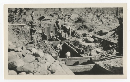 Laborers in trench repairing the San Diego flume following the 1916 flood