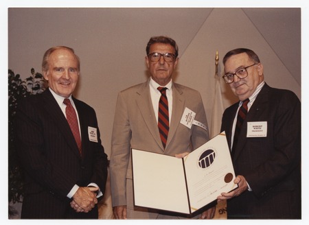 J. Robert Beyster holding certificate from National Academy of Engineering (NAE), with President of NAE Robert White, and ...